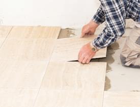 Tiler laying tiled marble 105413 379